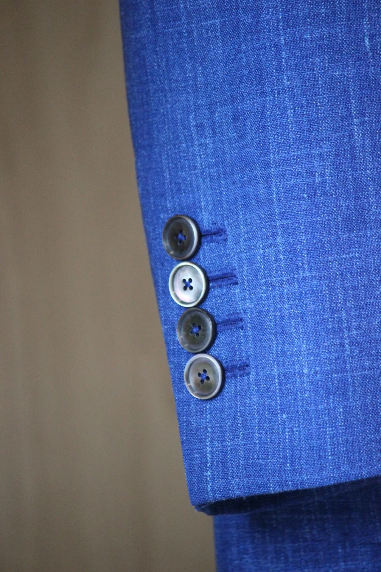 Mother-of-pearl cuff buttons on a Royal Blue Loro Piana Summertime sport jacket